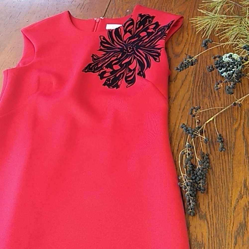 Red Clavin Klein dress with black flower detail